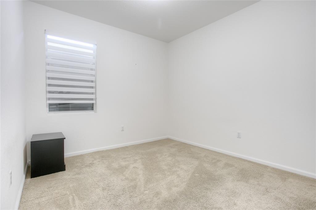 27775 Southwest 133rd Path Homestead, FL 33032 - Photo 4 of 16 an empty room with windows