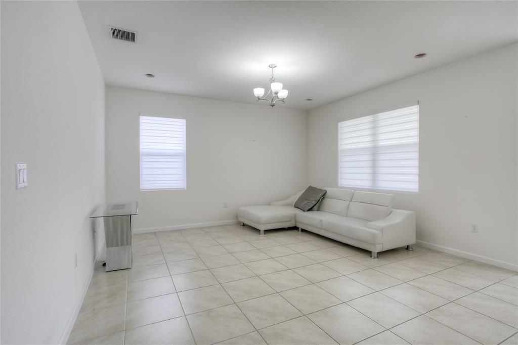 27775 Southwest 133rd Path Homestead, FL 33032 - Photo 5 of 16 a living room with furniture and a window