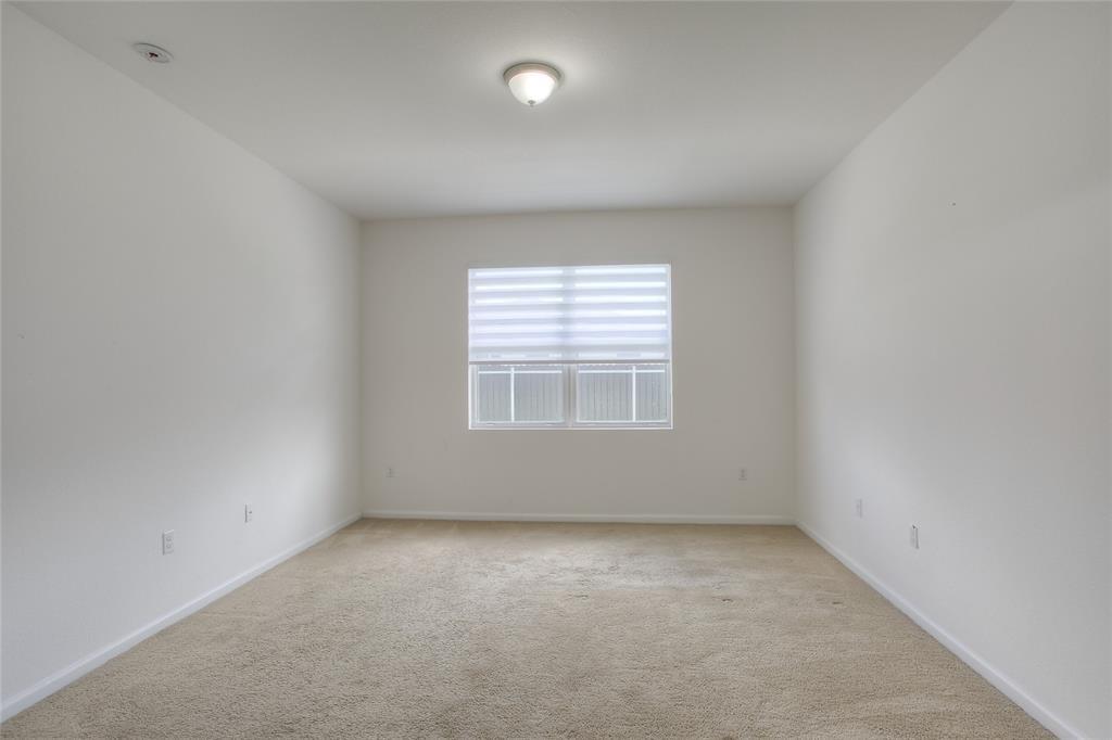 27775 Southwest 133rd Path Homestead, FL 33032 - Photo 8 of 16 an empty room with a window
