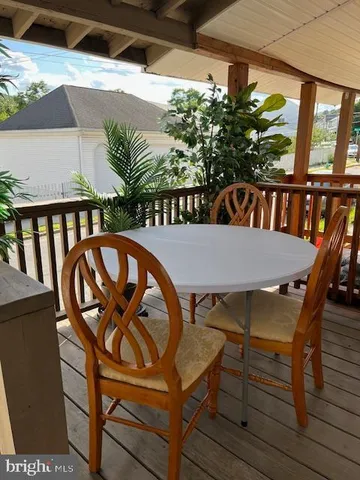 a view of a chairs and table in patio
