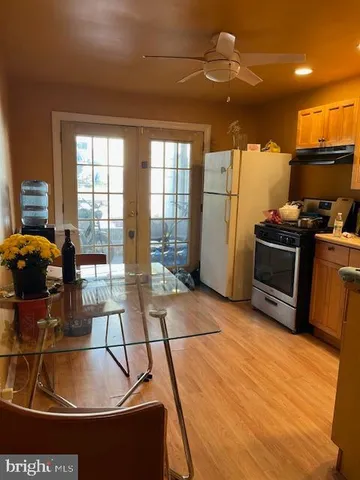 a kitchen with stainless steel appliances granite countertop a sink and a stove