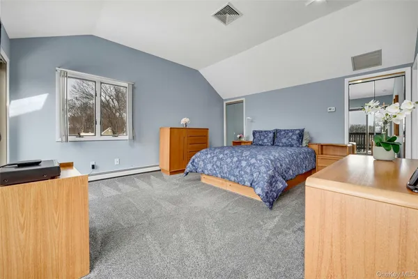 a bed room with a bed and a television