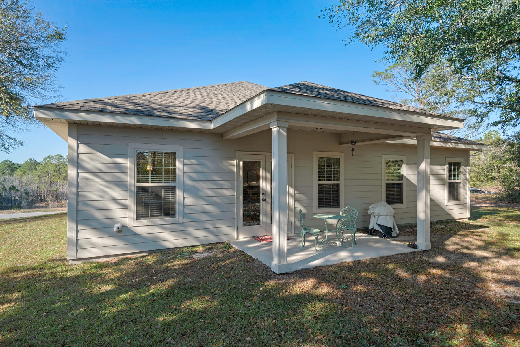6031 Hidden Valley Road Crestview, FL 32539 - Photo 40 of 41 a view of a house with porch and furniture