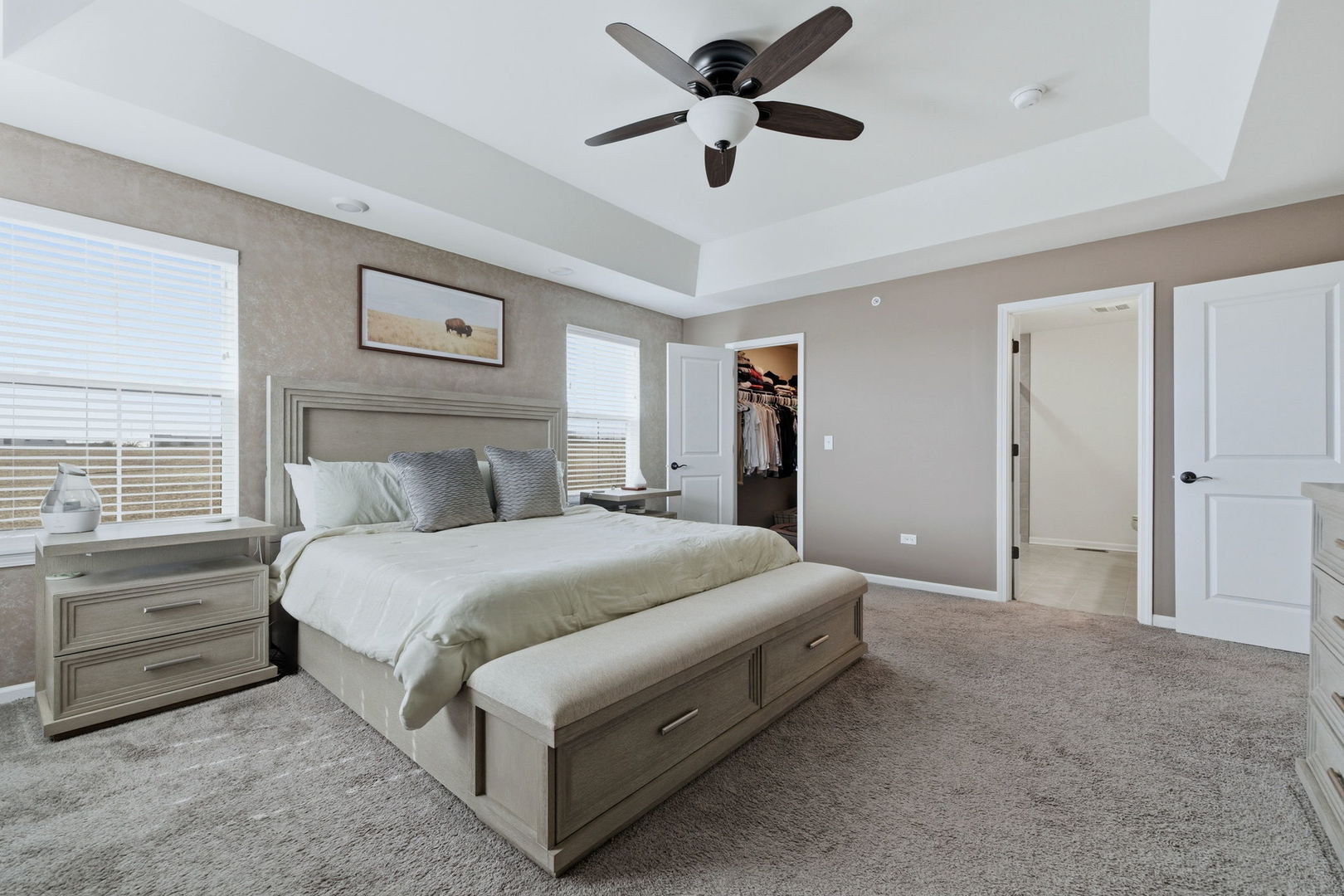 16436 Wheatgrass Street Lockport, IL 60441 - Photo 12 of 23 a bedroom with a bed and a chandelier