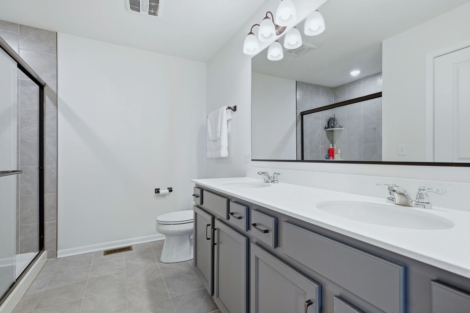 16436 Wheatgrass Street Lockport, IL 60441 - Photo 13 of 23 a bathroom with a toilet a sink and mirror