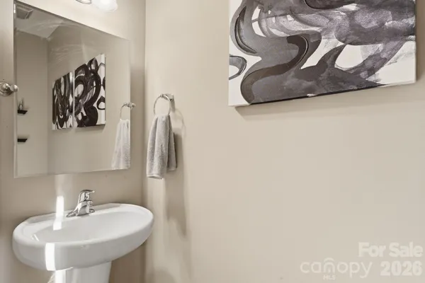 a bathroom with a sink and mirror
