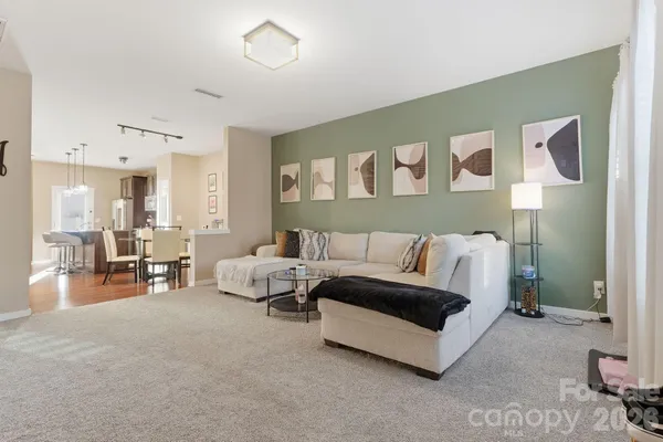 a living room with furniture and a table
