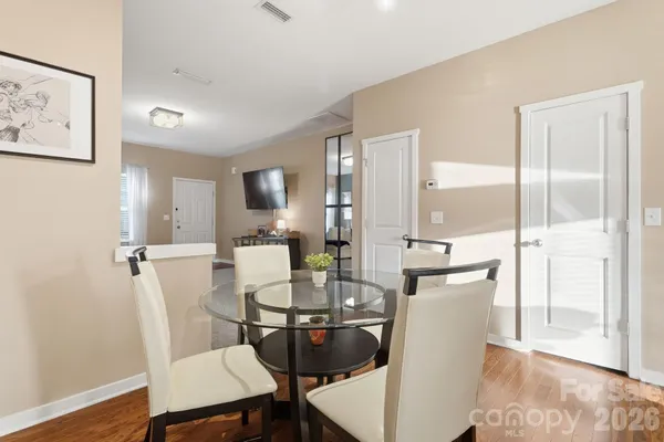 a view of a dining room with furniture window and wooden floor