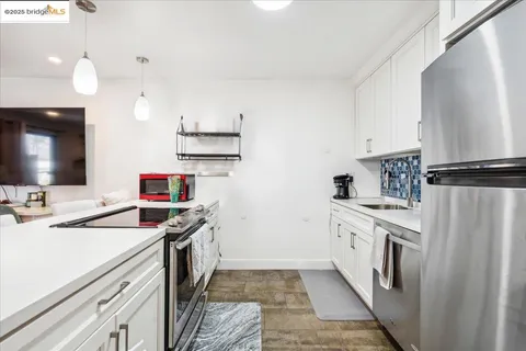 a kitchen with a stove and a sink