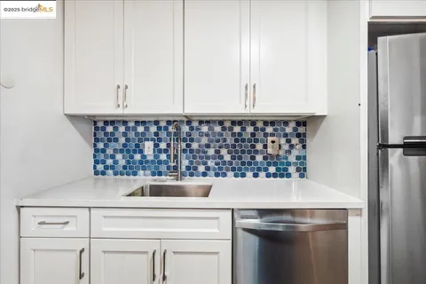a kitchen with a sink and a stove