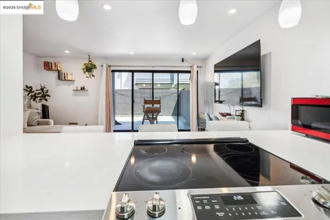 a living room with furniture and large windows