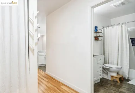 a view of bathroom and shower