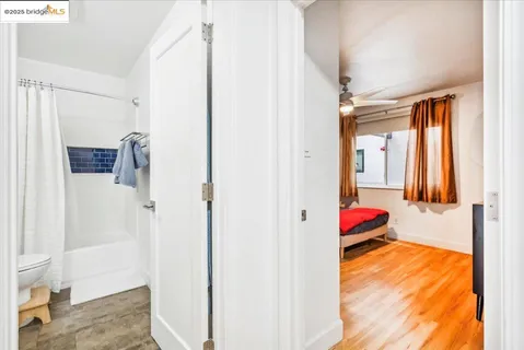 a bedroom with furniture and a window