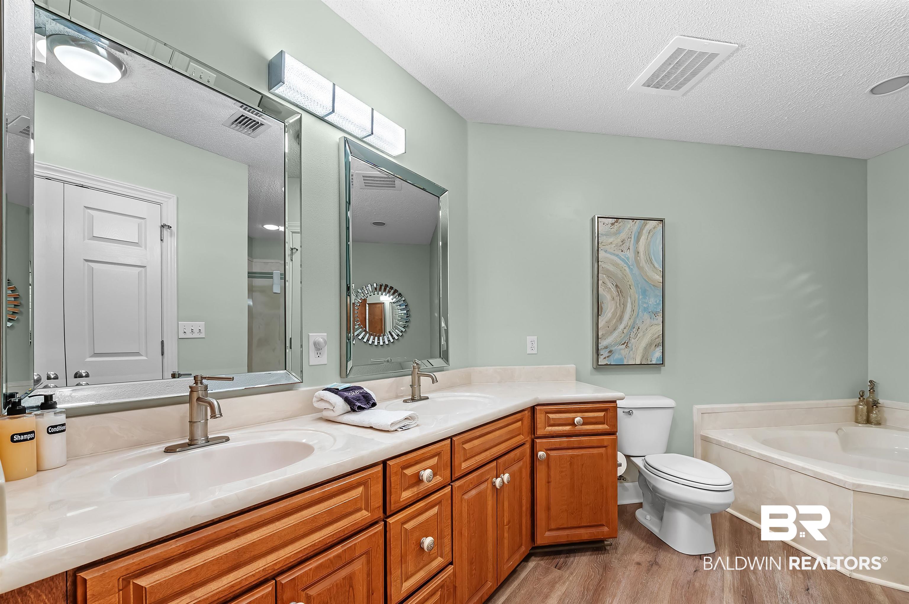 27582 Canal Road, Unit 2104 Orange Beach, AL 36561 - Photo 22 of 35 Bathroom with, a bathtub, double vanities, walk in shower and toilet