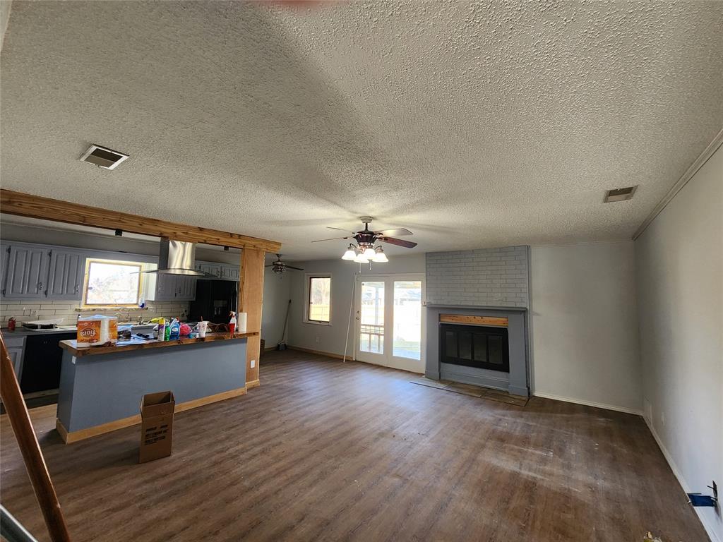 803 10th Street Princeton, TX 75407 - Photo 2 of 12 a view of a livingroom with a fireplace