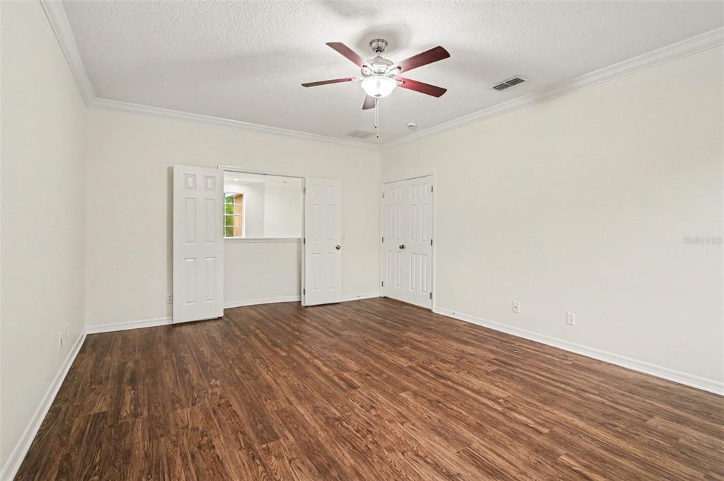 4819 Indian Deer Road Windermere, FL 34786 - Photo 15 of 30 an empty room with wooden floor and windows