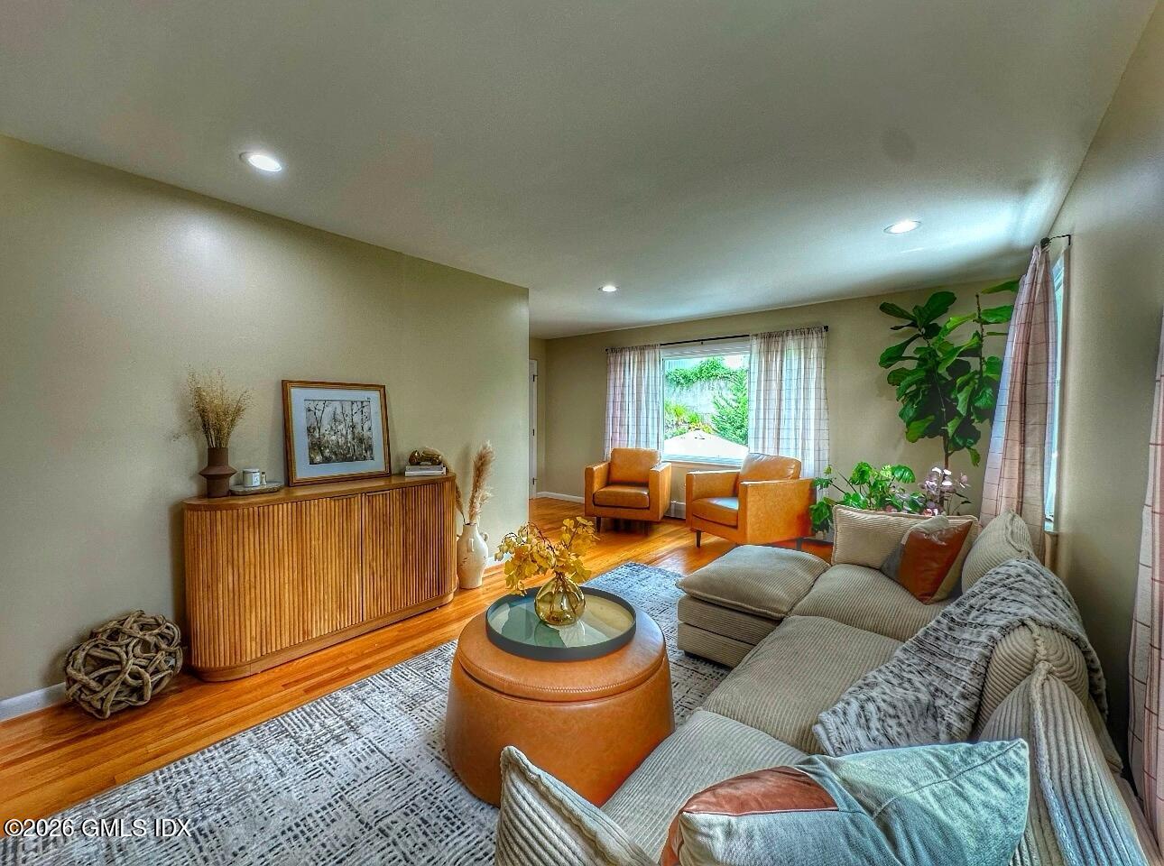 37 Gerry Street Greenwich, CT 06830 - Photo 3 of 14 a living room with furniture a rug and a window