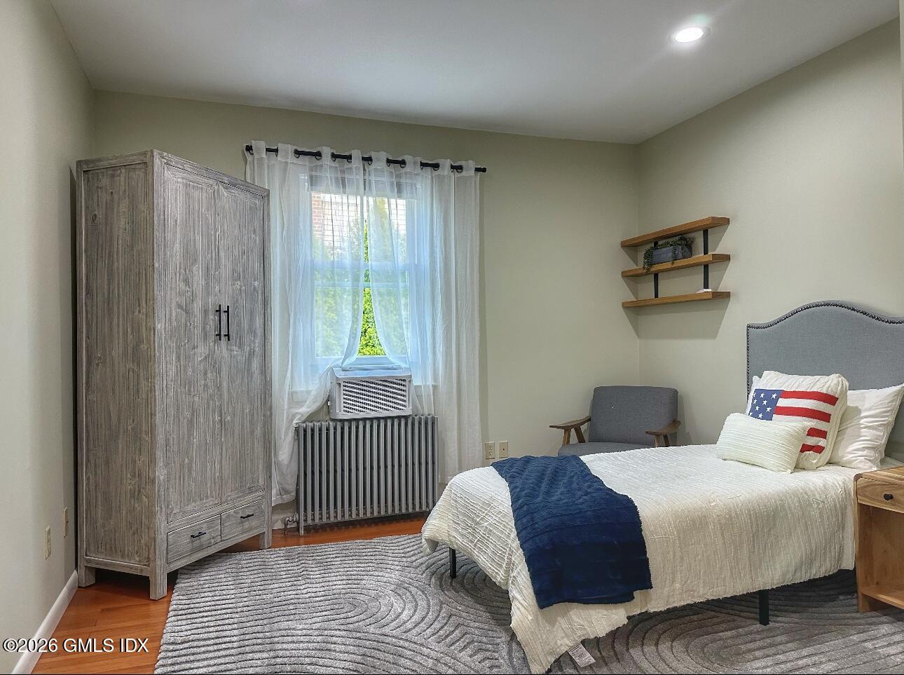 37 Gerry Street Greenwich, CT 06830 - Photo 5 of 14 a bedroom with a bed and a window