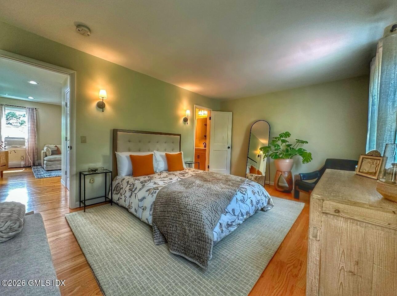 37 Gerry Street Greenwich, CT 06830 - Photo 7 of 14 a bedroom with a bed and wooden floor