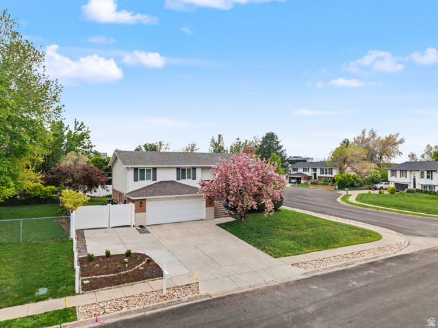 523 Mountain View Road Centerville, UT 84014 - Photo 28 of 33 View of front of home featuring concrete driveway, a shingled roof, and a gate.