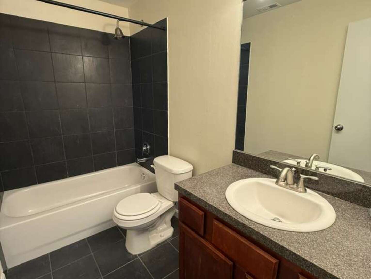 5900 Forest View Road, Unit 1A Lisle, IL 60532 - Photo 10 of 12 a bathroom with a sink a toilet and shower