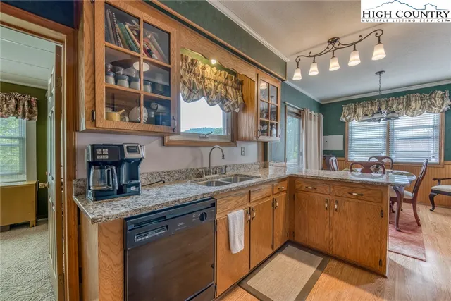 a kitchen with stainless steel appliances granite countertop a stove and a sink