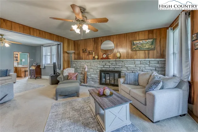 a living room with furniture and a fireplace