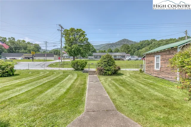 a view of swimming pool with a yard