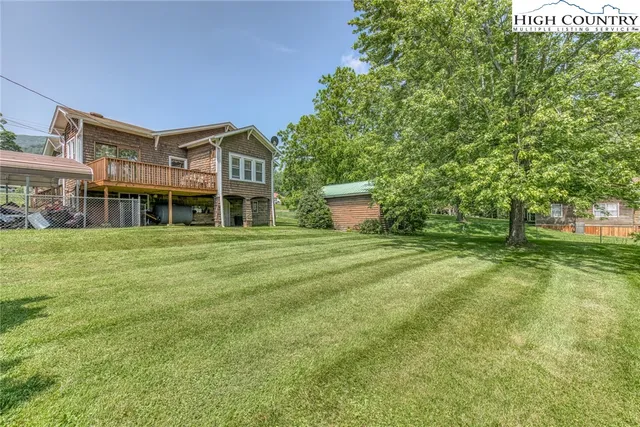 a front view of a building with a garden