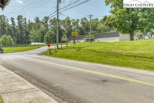 a kitchen with stainless steel appliances a sink a refrigerator and cabinets