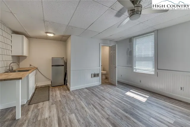 a bathroom with a sink toilet and a mirror