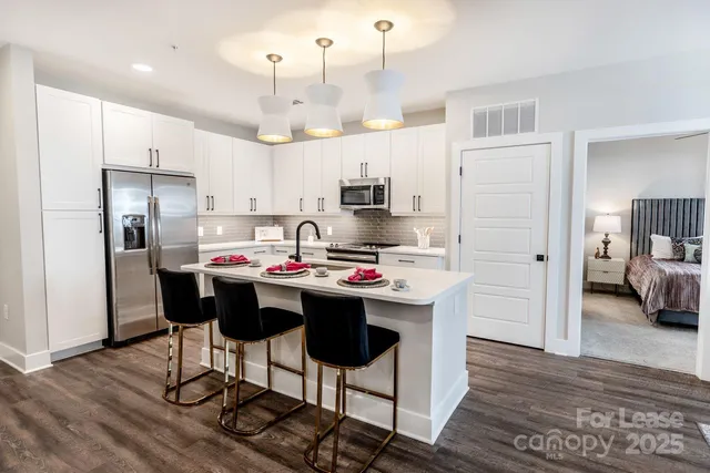 a living room with furniture a rug and a window