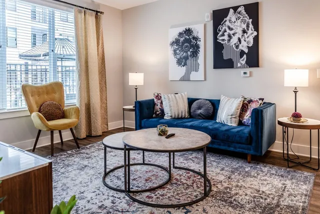 a bedroom with a bed and a night stand