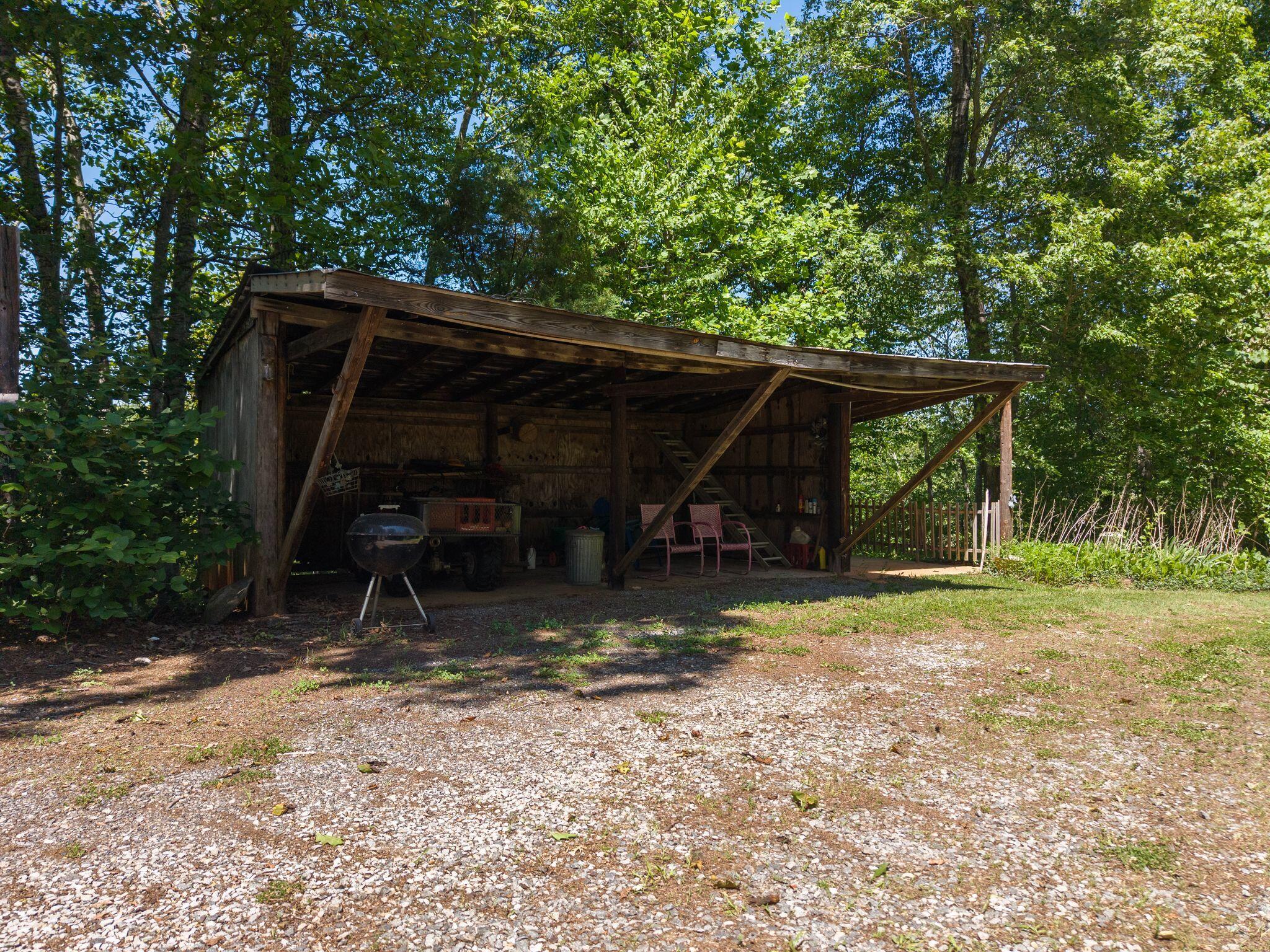 1115 Robin Ridge Road Henry, VA 24102 - Photo 36 of 54 a view of a barn in the middle of a yard