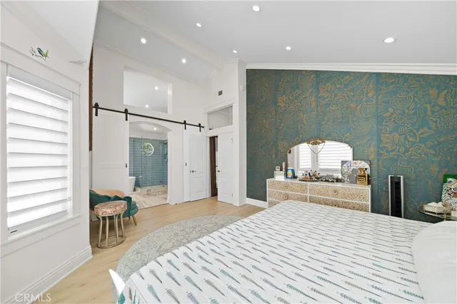 a bedroom with a bed and a couch