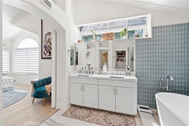 a bathroom with a sink mirror and toilet