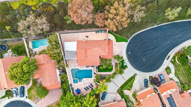 an aerial view of a house with a swimming pool