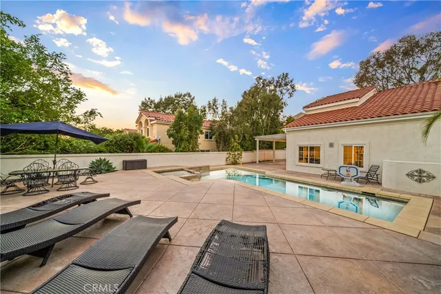 a view of a swimming pool and lounge chair