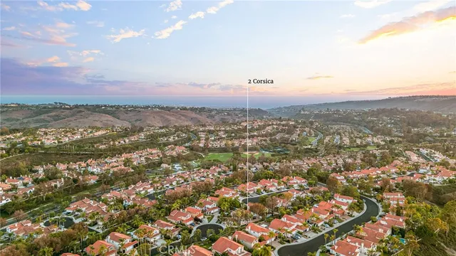 a view of a lake with cars parked