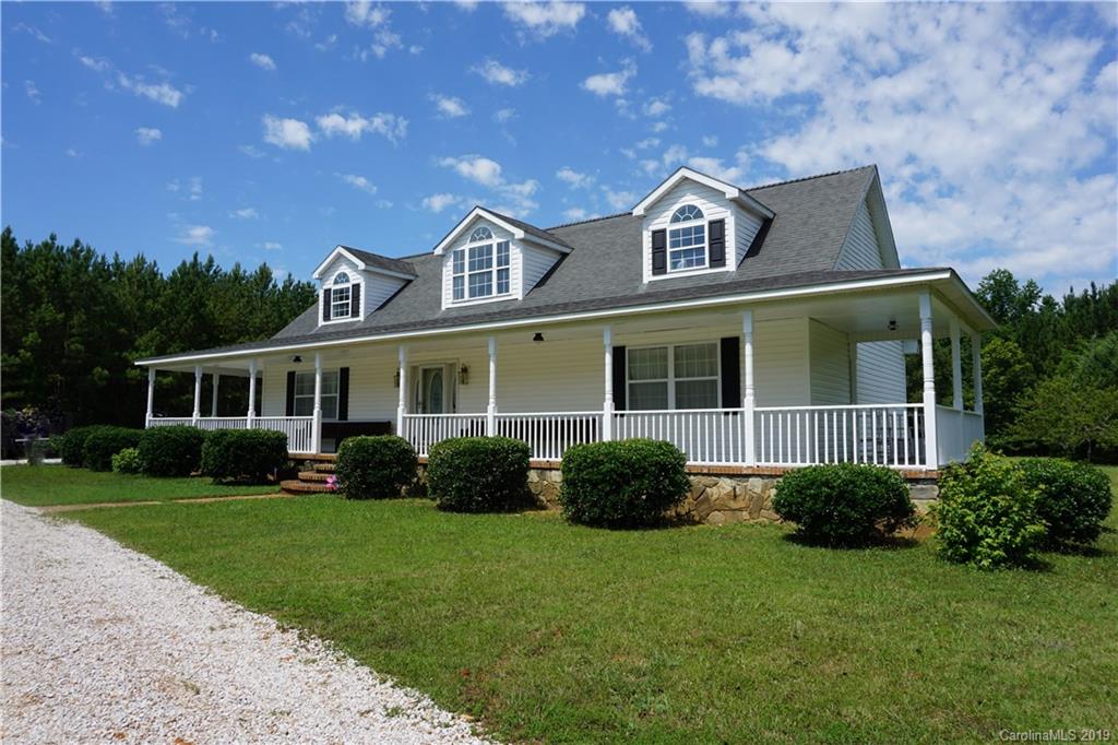 2390 Gill Jordan Road Chester, SC 29706 - Photo 4 of 44 a front view of a house with a garden