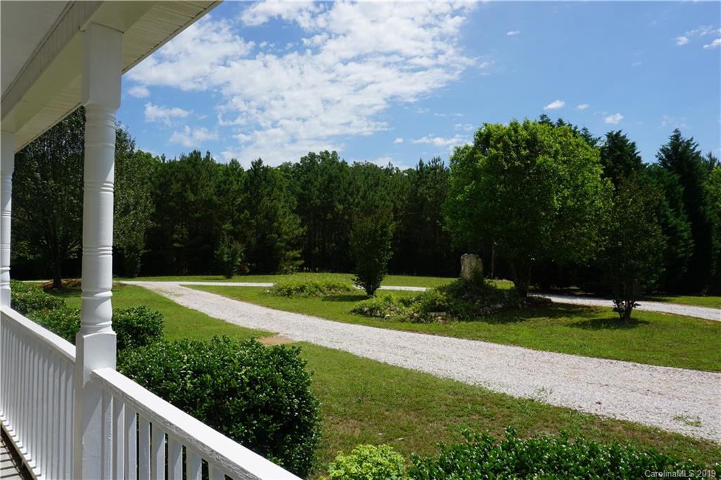 2390 Gill Jordan Road Chester, SC 29706 - Photo 6 of 44 a view of a garden with a building in the background