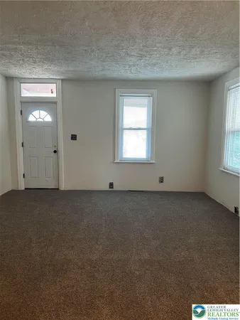 an empty room that has a window