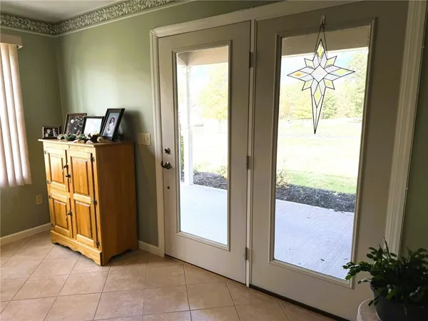 a spacious bedroom with a bed and a window
