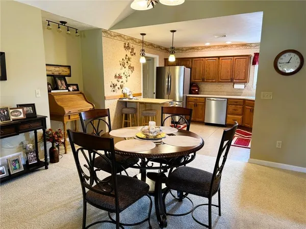 a view of a dining room with furniture