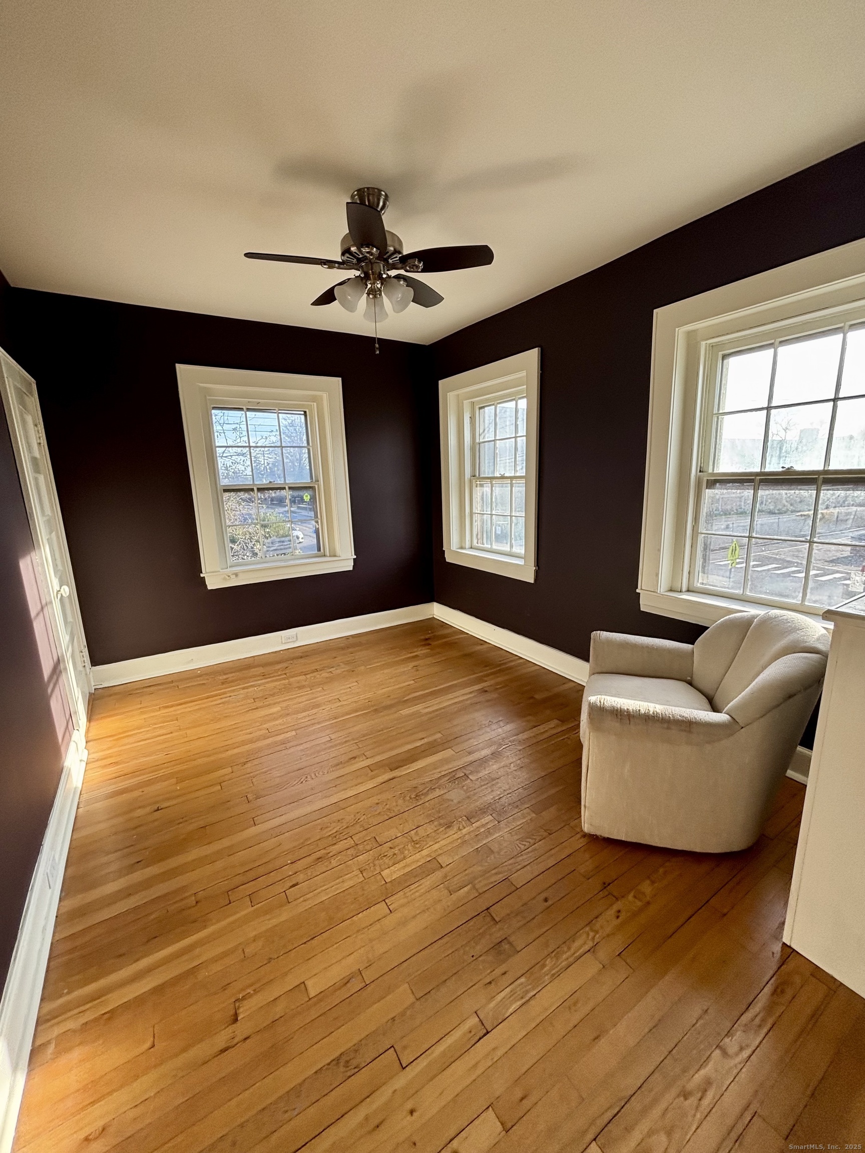 554 Brewster Street, Unit 4 Bridgeport, CT 06605 - Photo 11 of 24 a living room with furniture and a large window