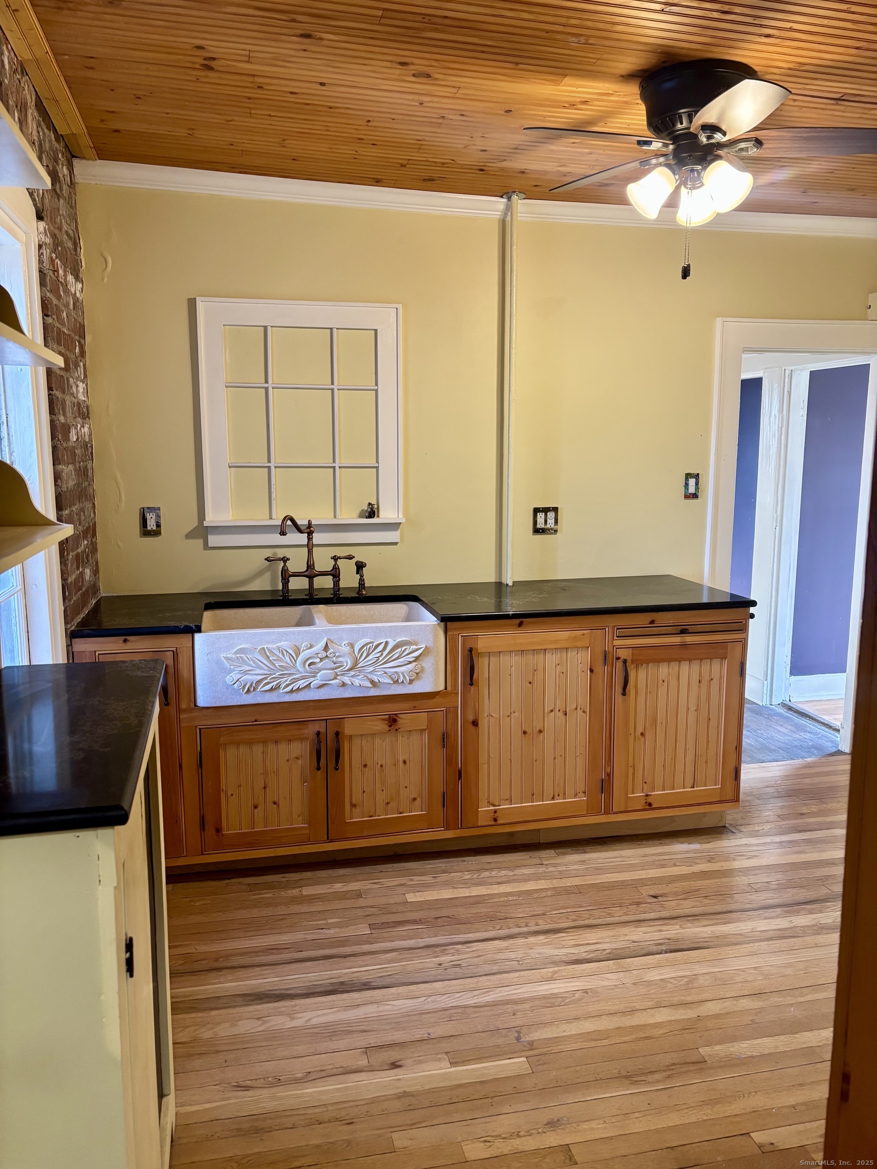 554 Brewster Street, Unit 4 Bridgeport, CT 06605 - Photo 16 of 24 a bathroom with a granite countertop sink and a mirror