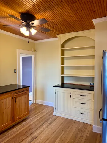 a kitchen with a wooden floor