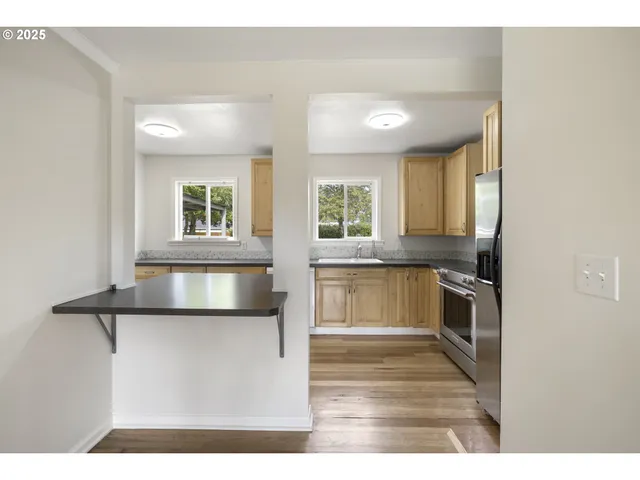 a kitchen with a stove and a refrigerator