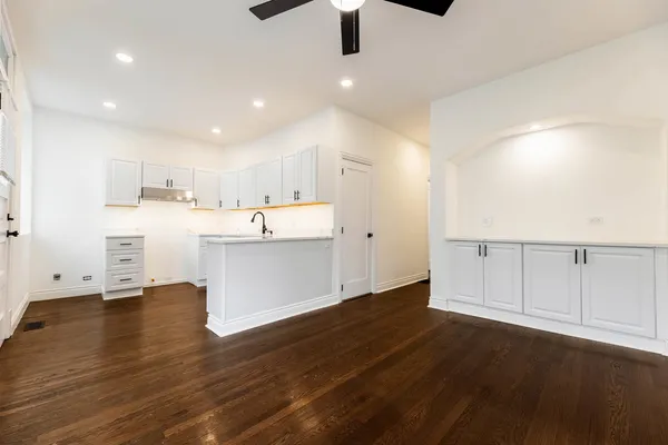 a kitchen with a sink stainless steel appliances and cabinets