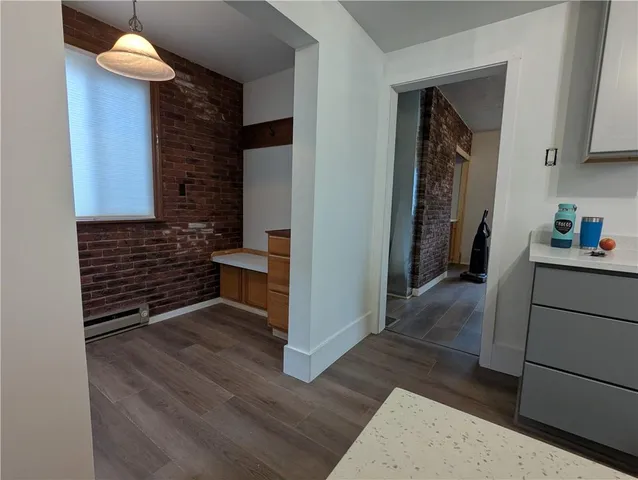a kitchen with granite countertop a stove and a refrigerator
